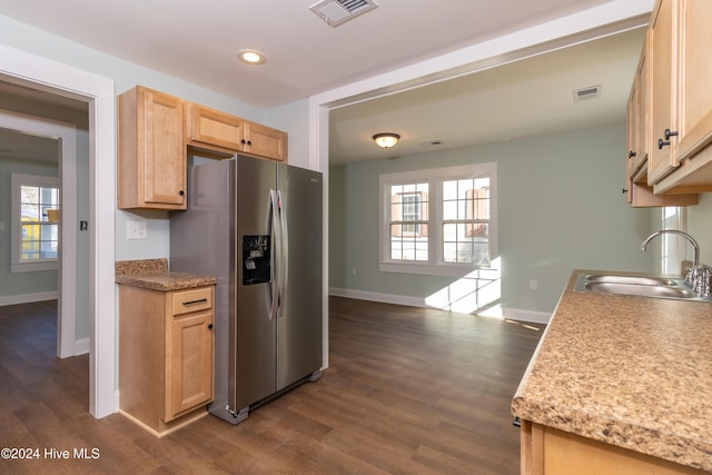 kitchen with light brown cabinetry, stainless steel fridge with ice dispenser, sink, and dark wood-type flooring