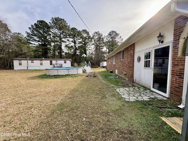 1394 Lake Cole Rd, Midway Park, NC 28544 - view of grassy yard with an outdoor pool