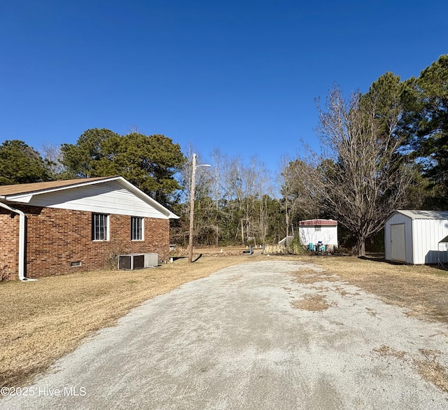 1394 Lake Cole Rd, Midway Park, NC 28544 - view of property exterior with brick siding and central air condition unit