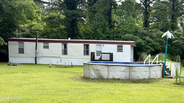 1394 Lake Cole Rd, Midway Park, NC 28544 - back of house featuring a lawn and an outdoor pool