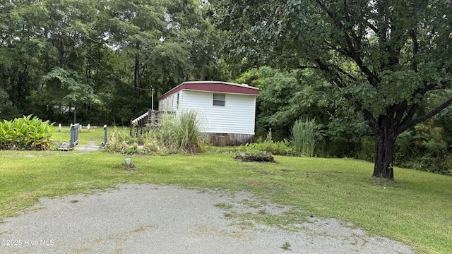 1394 Lake Cole Rd, Midway Park, NC 28544 - view of grassy yard featuring an outbuilding