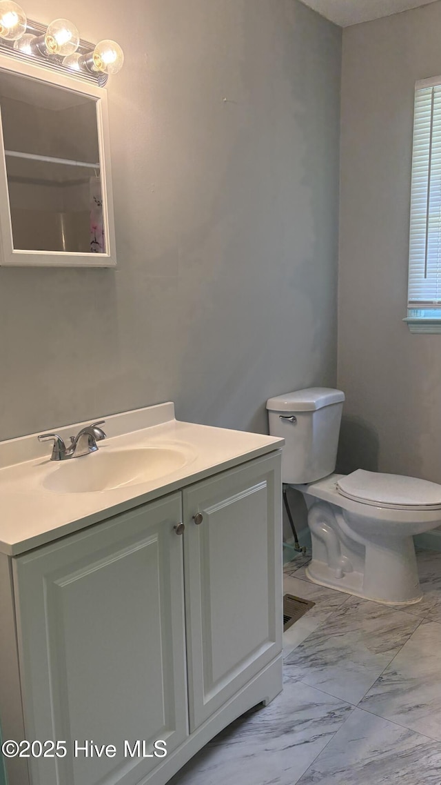 1394 Lake Cole Rd, Midway Park, NC 28544 - full bathroom with marble finish floors, toilet, vanity, and curtained shower