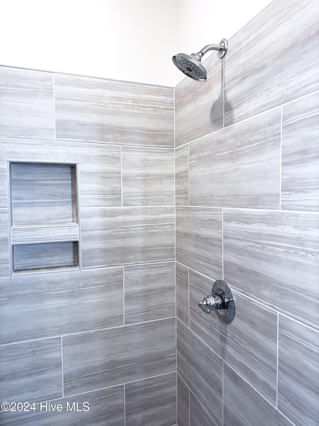 room details with a tile shower