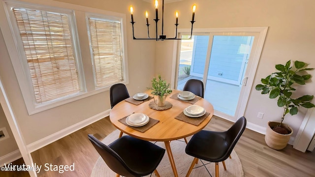 interior space with ceiling fan, ornamental molding, and hardwood / wood-style floors