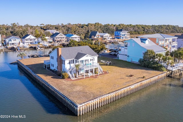 bird's eye view with a residential view and a water view