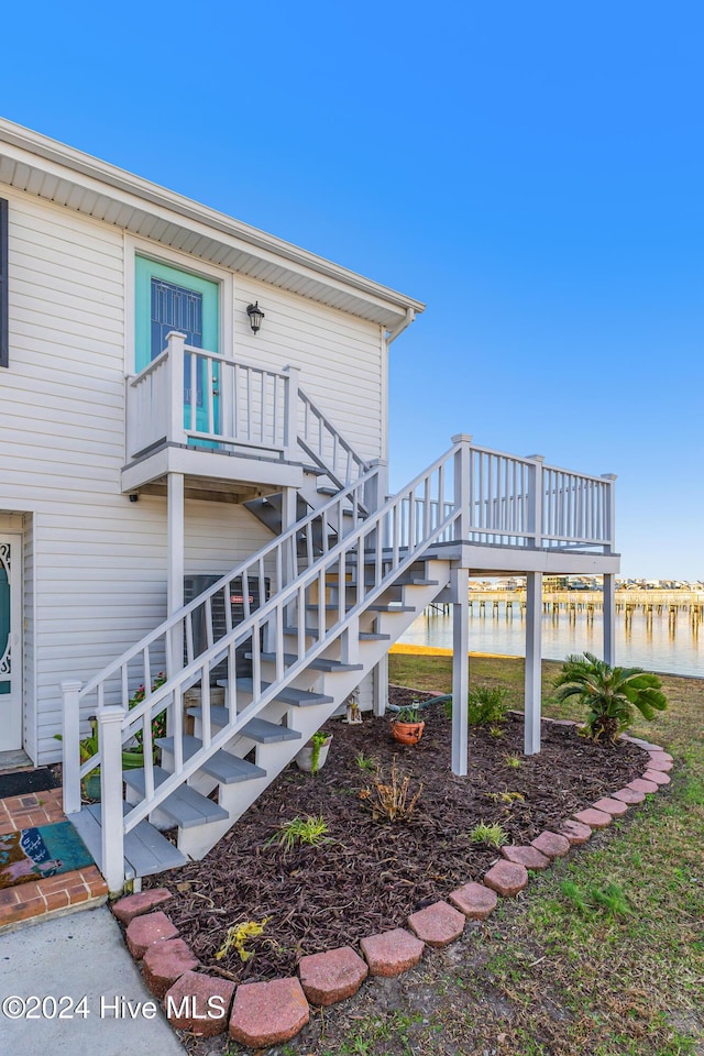 exterior space featuring a wooden deck and stairway