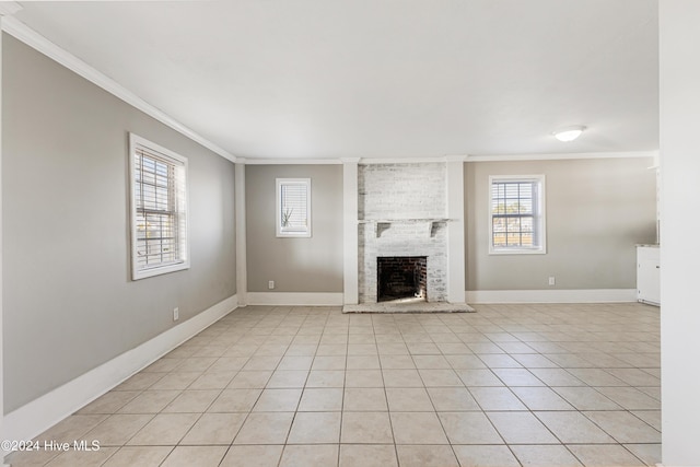 unfurnished living room with crown molding, a fireplace, and baseboards