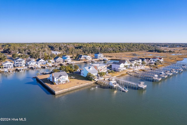 bird's eye view featuring a water view, a residential view, and a view of trees