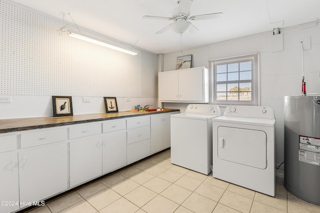 laundry room with cabinets, electric water heater, ceiling fan, sink, and separate washer and dryer