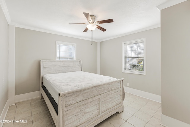 bedroom featuring crown molding, light tile patterned flooring, and multiple windows