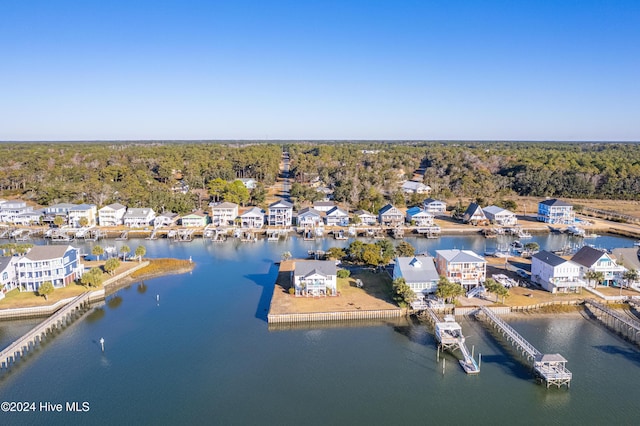 bird's eye view with a residential view, a water view, and a view of trees