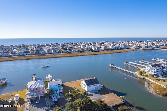 bird's eye view with a water view and a residential view