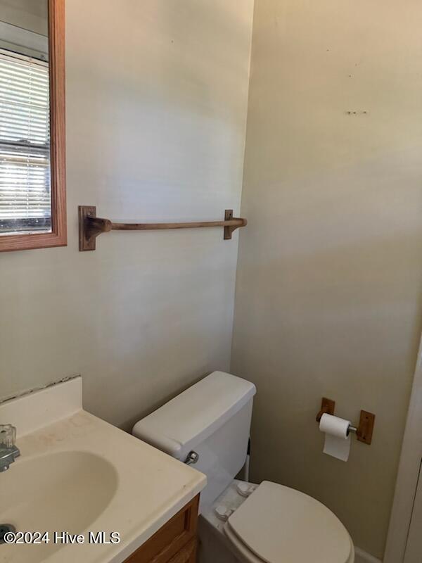 bathroom featuring vanity and toilet