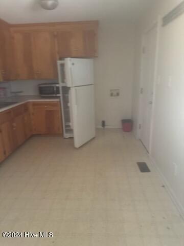 kitchen featuring white fridge