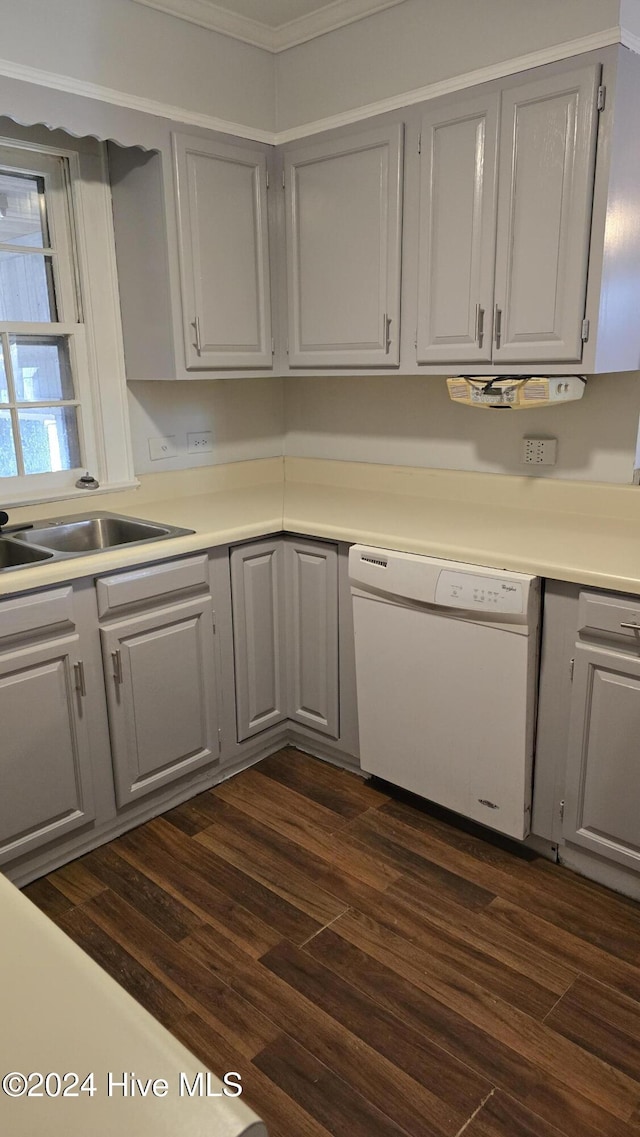 kitchen featuring dishwasher, dark hardwood / wood-style flooring, gray cabinets, and ornamental molding