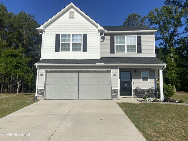 49 Patrick Henry Cir NW, Supply, NC 28462 - view of front facade featuring driveway, an attached garage, and a front yard