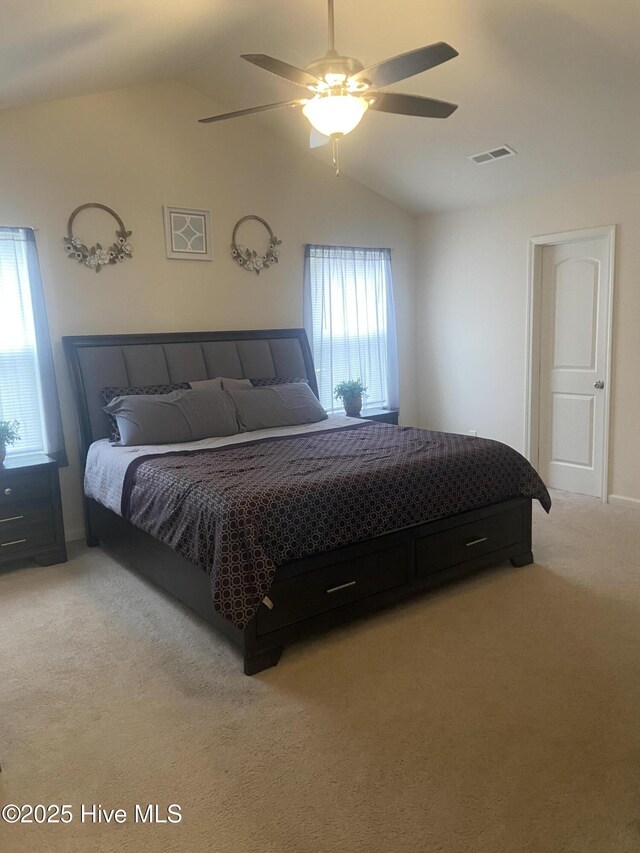 49 Patrick Henry Cir NW, Supply, NC 28462 - bedroom with lofted ceiling, light colored carpet, and a ceiling fan