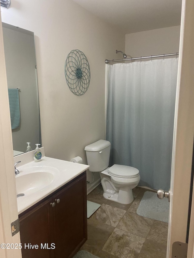 49 Patrick Henry Cir NW, Supply, NC 28462 - bathroom featuring toilet, vanity, and curtained shower