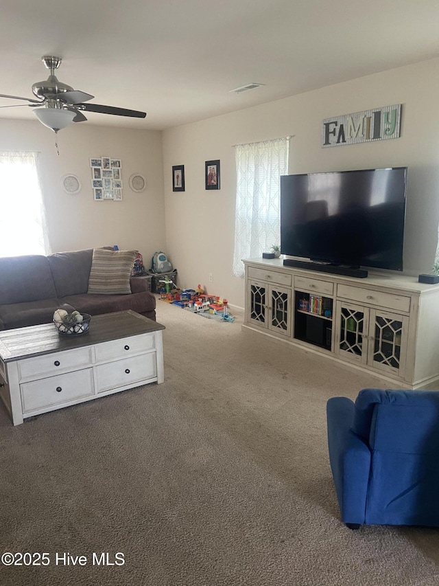 49 Patrick Henry Cir NW, Supply, NC 28462 - living room featuring ceiling fan and carpet floors
