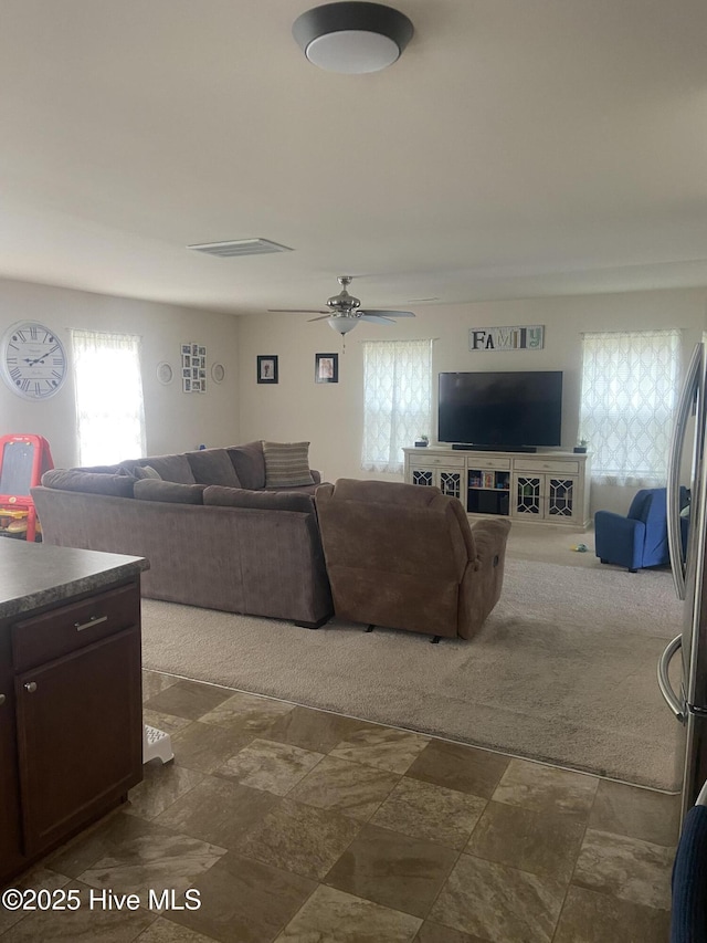 49 Patrick Henry Cir NW, Supply, NC 28462 - living room with dark stone finish floors and ceiling fan