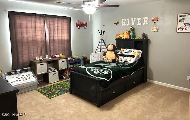 carpeted bedroom with ceiling fan