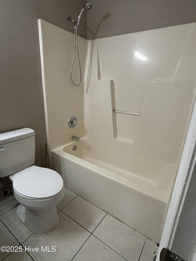 bathroom featuring tile patterned floors,  shower combination, and toilet