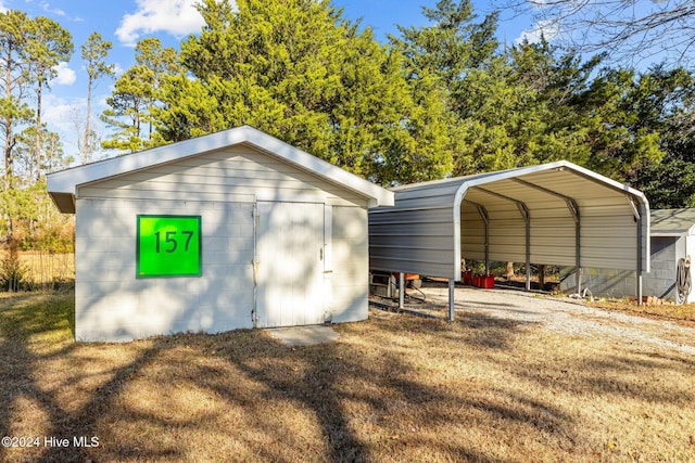 view of outbuilding with a carport