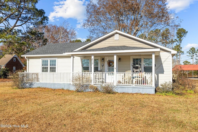 view of front of home with a front lawn and covered porch