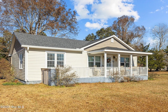 view of front facade featuring a front lawn and covered porch