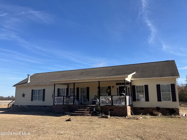 ranch-style house with covered porch