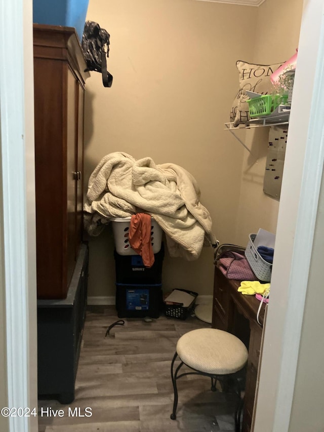 laundry area with hardwood / wood-style floors