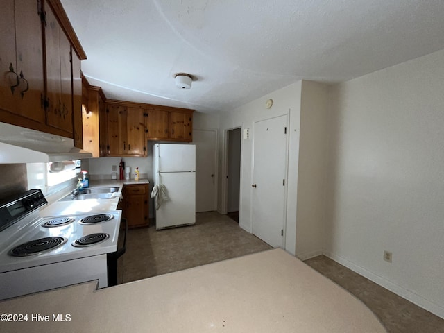 kitchen featuring white appliances and sink