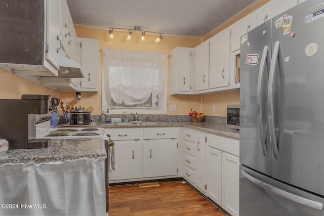 kitchen with white cabinetry, crown molding, hardwood / wood-style flooring, and appliances with stainless steel finishes