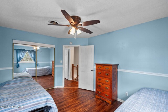 bedroom featuring ceiling fan, dark carpet, and ornamental molding