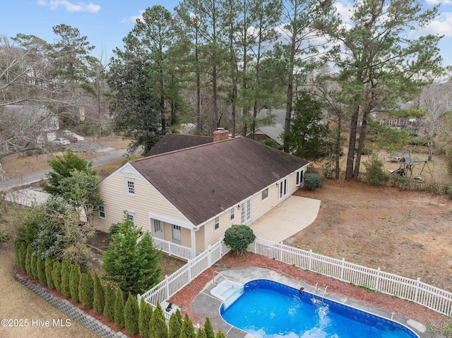 view of swimming pool with a patio