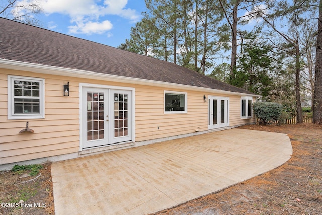 rear view of property with a patio area and french doors