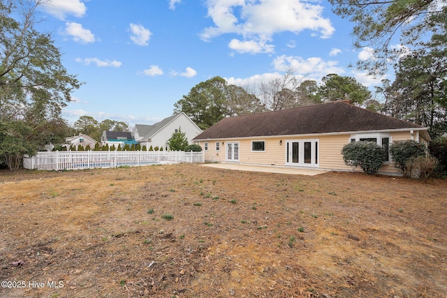 back of property featuring a patio and french doors