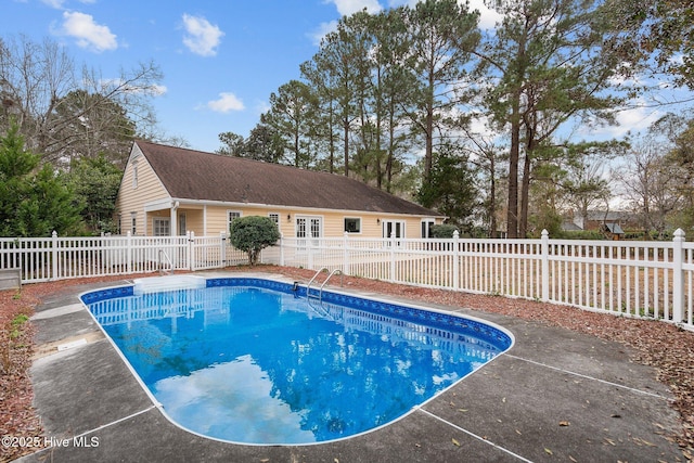 view of pool with french doors