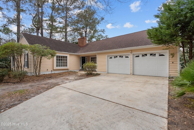 ranch-style house featuring a garage