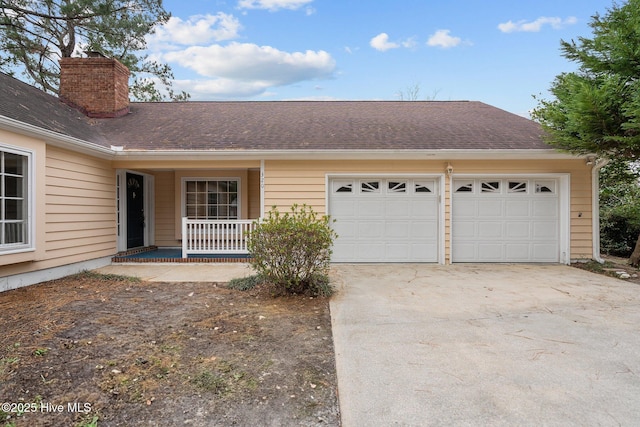 view of front of property featuring covered porch and a garage