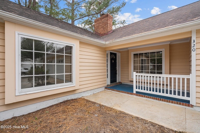 entrance to property featuring covered porch