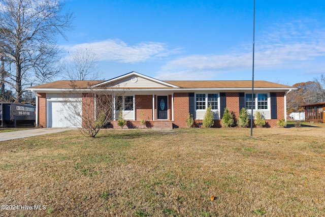 ranch-style house with a garage and a front lawn