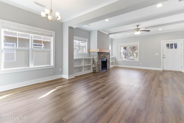 unfurnished living room with a fireplace, plenty of natural light, ornamental molding, and hardwood / wood-style flooring