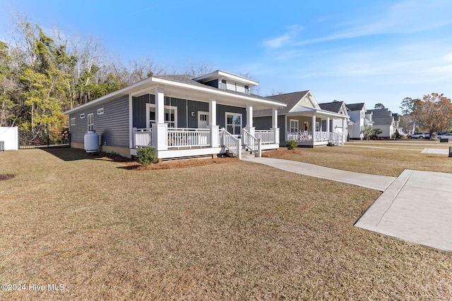 view of front of house featuring a porch and a front lawn