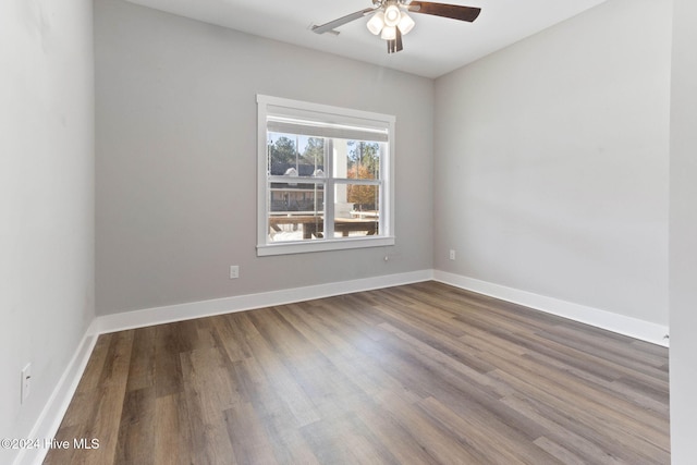 unfurnished room featuring ceiling fan and hardwood / wood-style floors