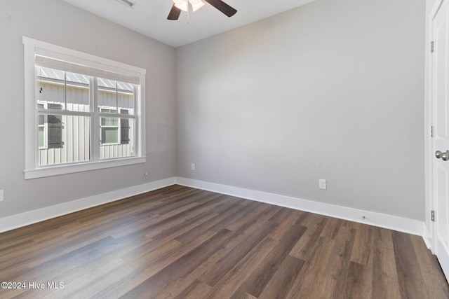 unfurnished room featuring ceiling fan and dark hardwood / wood-style flooring