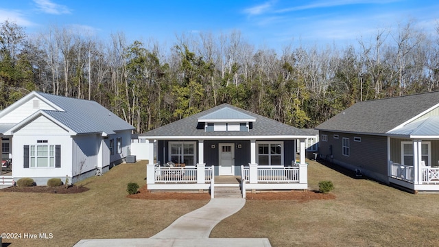 view of front of house with a front lawn and a porch