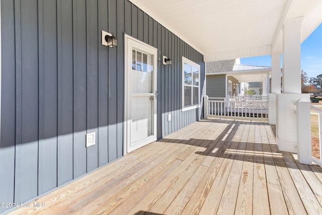 wooden terrace featuring a porch