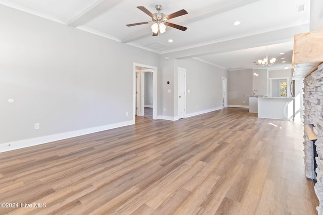 unfurnished living room featuring beam ceiling, light hardwood / wood-style flooring, ceiling fan with notable chandelier, and ornamental molding