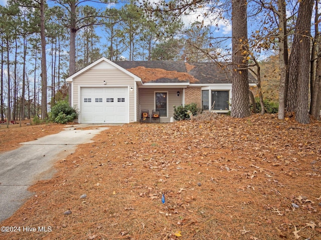 single story home with a garage